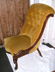 SOLD - A Victorian Mahogany slipper chair, this chair has very good carving and is upholstered in gold velvet.