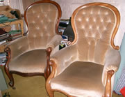 A very near matching pair of Victorian mahogany showood armchairs