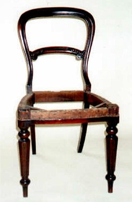 For Sale - An early Victorian Balloon back dining chair, in Mahogany with a carved rail.