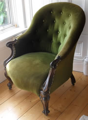 An Elegant Rosewood Victorian Armchair with Button Back c1860
